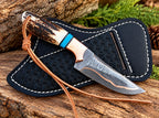 Copper Damascus blade with copper edge lining close-up on skinner knife
