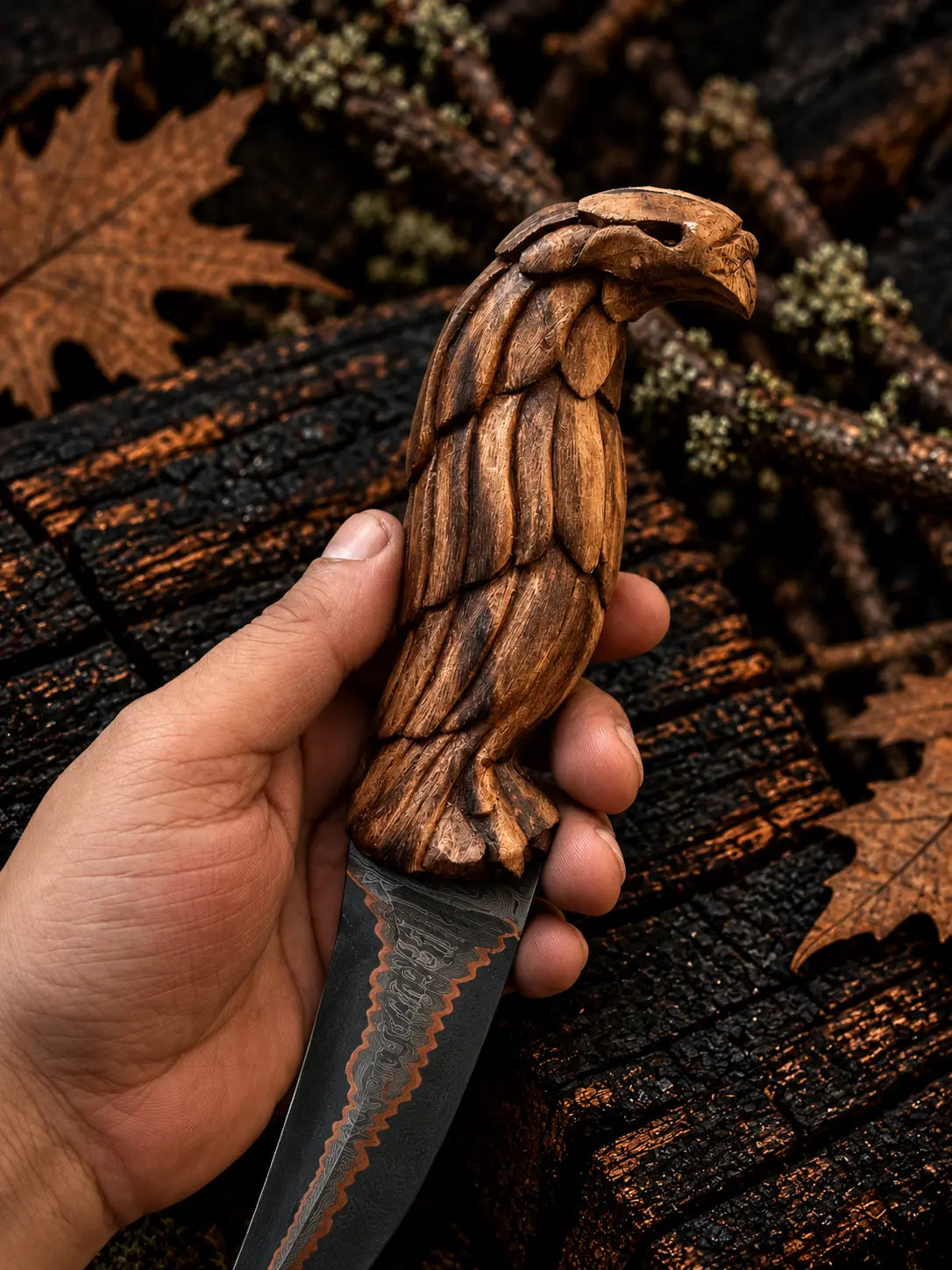 Copper Damascus knife with hand-carved eagle wood handle - angle 2
