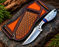 Handmade D2 steel cowboy knife with marble handle and blue resin spacer - full view
