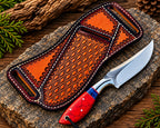 D2 steel drop point blade close-up on red crackle handle cowboy knife