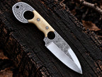 Hand engraved floral scrollwork on D2 steel blade and engraved finger hole ring with white bone handle