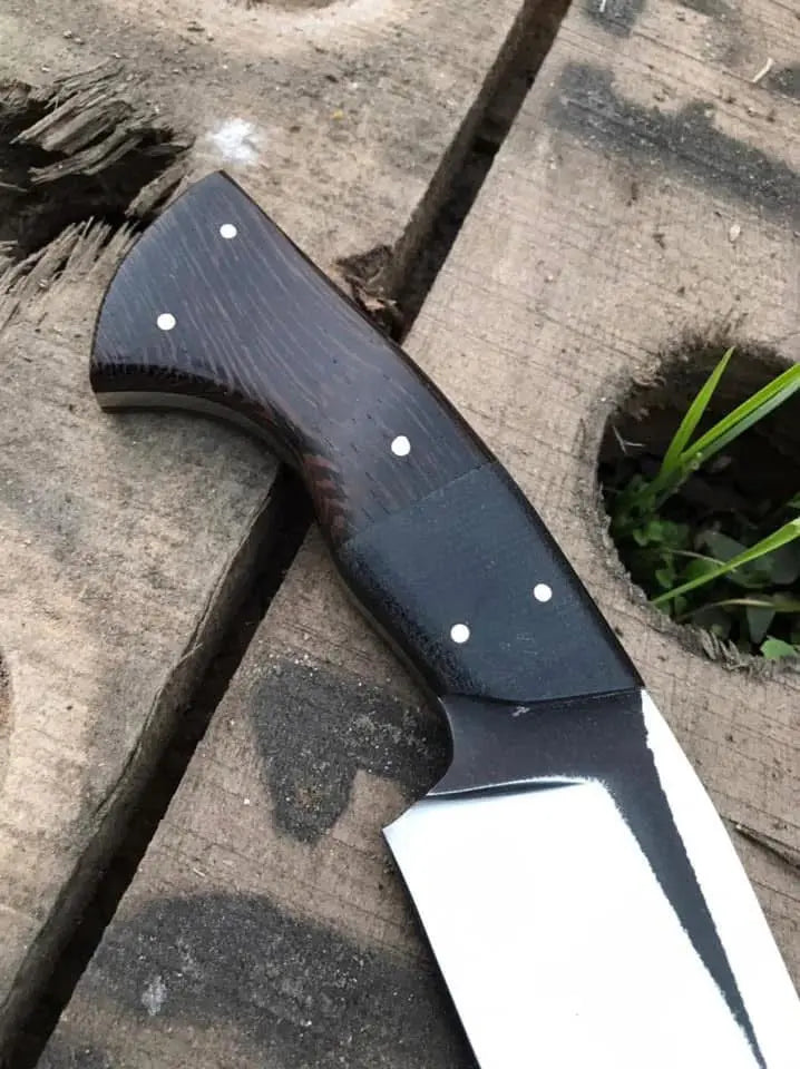 D2 steel blade close-up on black handle hunting knife