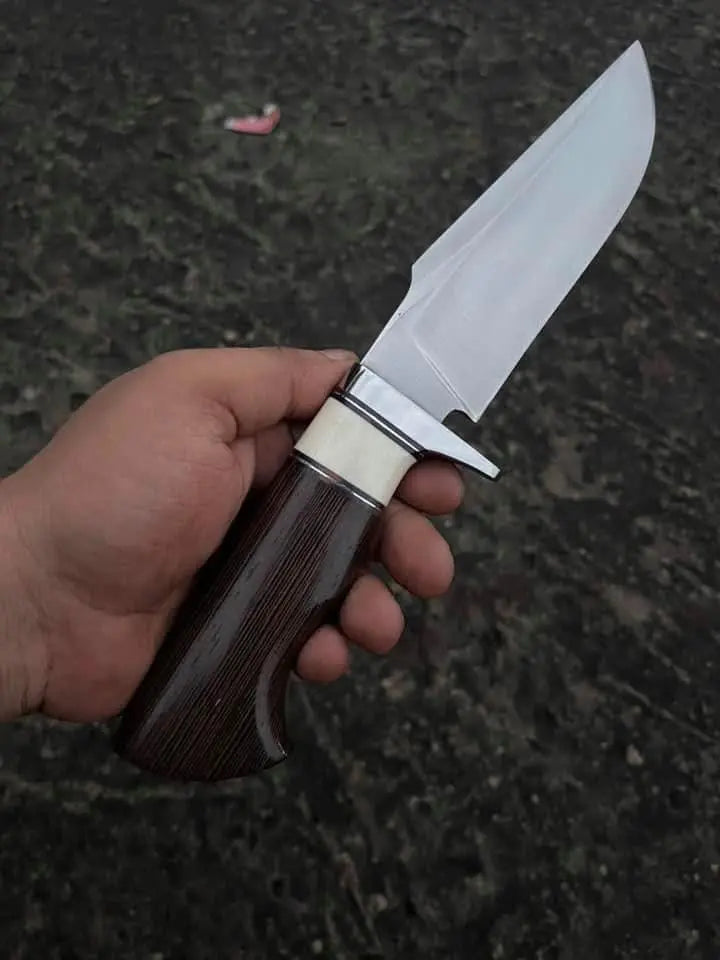 Hand-carved hippo face design on Italian leather sheath for D2 steel hunting knife