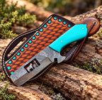 Damascus bull cutter on wood background - side angle