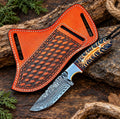 Handmade Damascus steel cowboy knife with blue and gold turquoise handle and tooled leather sheath