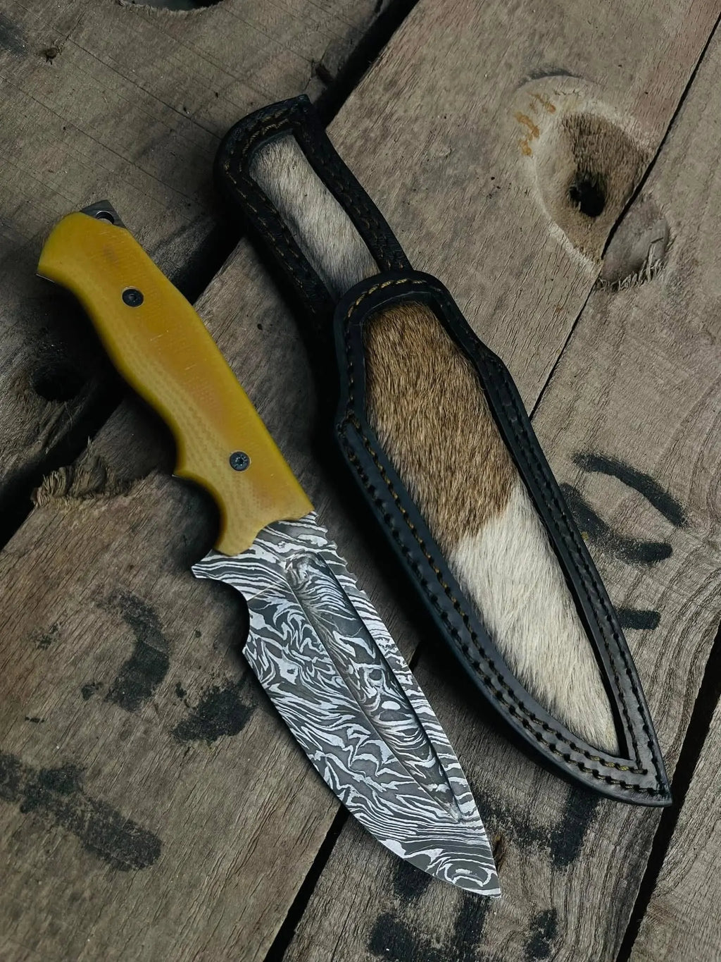 Handmade full tang Damascus cowboy knife with yellow G10 handle and hair-on cowhide sheath - full view