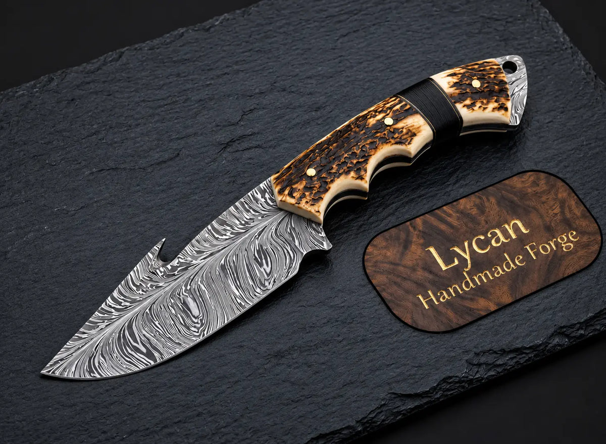 Handmade Damascus skinner knife with gut hook blade and stag handle - full view