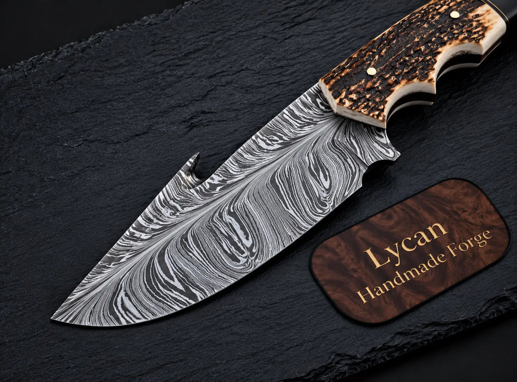 Gut hook notch detail on Damascus skinner knife blade