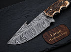 Gut hook notch detail on Damascus skinner knife blade