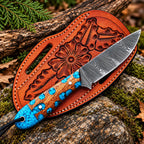 Damascus steel blade pattern close-up on turquoise inlay skinner knife