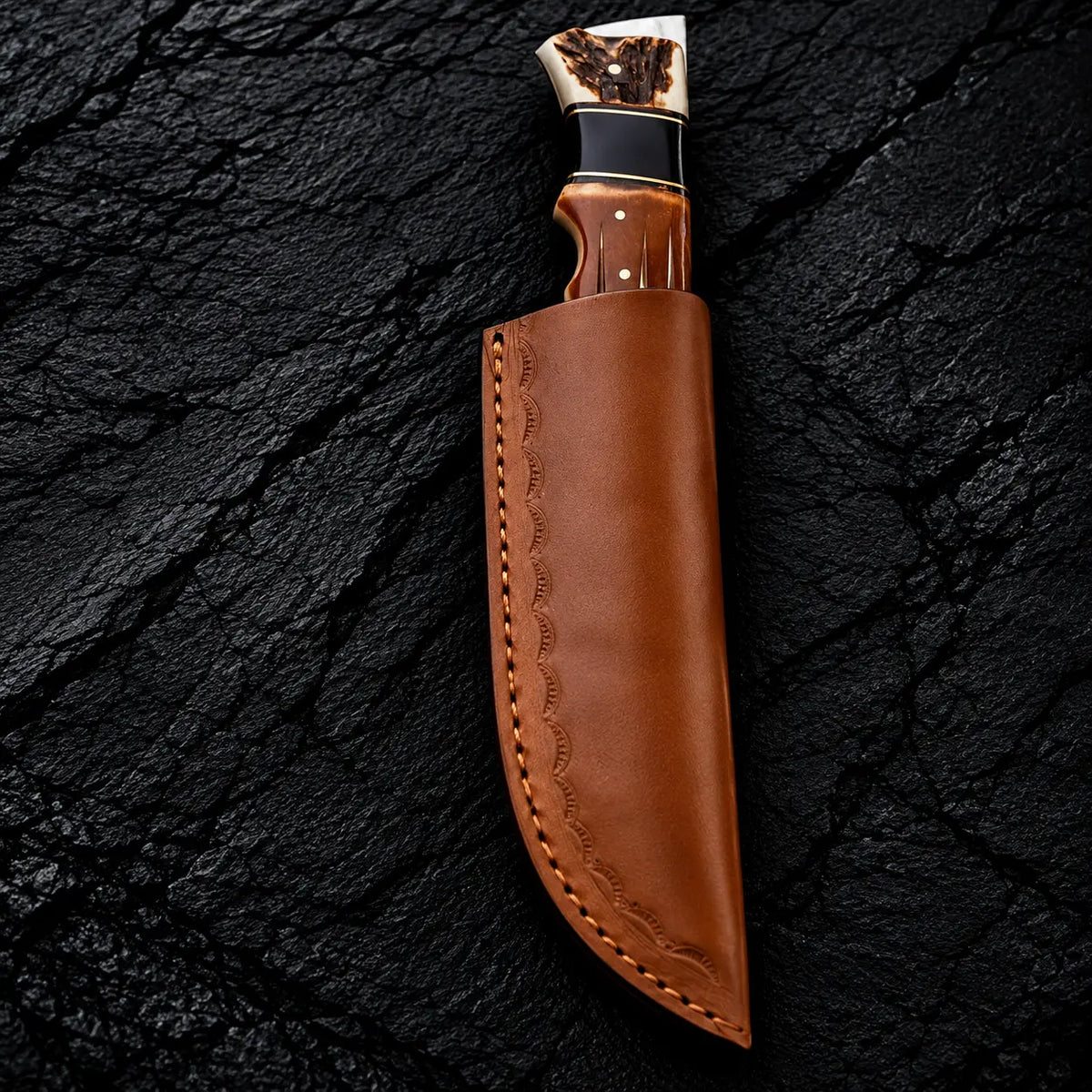 Stag horn, black buffalo horn and white bone handle with brass spacers detail