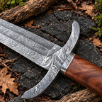 Damascus steel sword blade with fuller and flowing Damascus pattern close-up