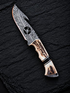 Handmade full tang Damascus skinner knife with wire-cut deer design and stag horn handle - full view