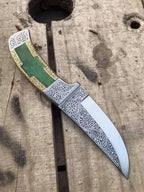 Scrollwork engraved blade close-up on dagger knife