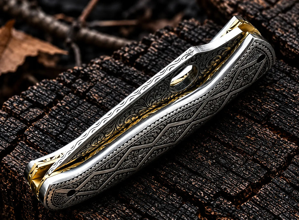 Hand engraved steel folding knife on wood background - angle view