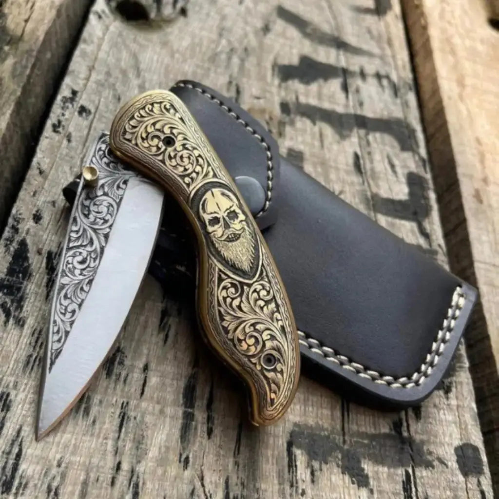 Skull handle folding pocket knife closed - side view
