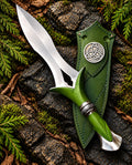 Handmade Viking style carbon steel knife with polished dagger blade, green handle, Celtic collar and green sheath with triquetra emblem