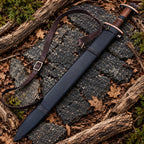 Wood handle with black micarta spacer, oval guard and disc pommel on Viking sword